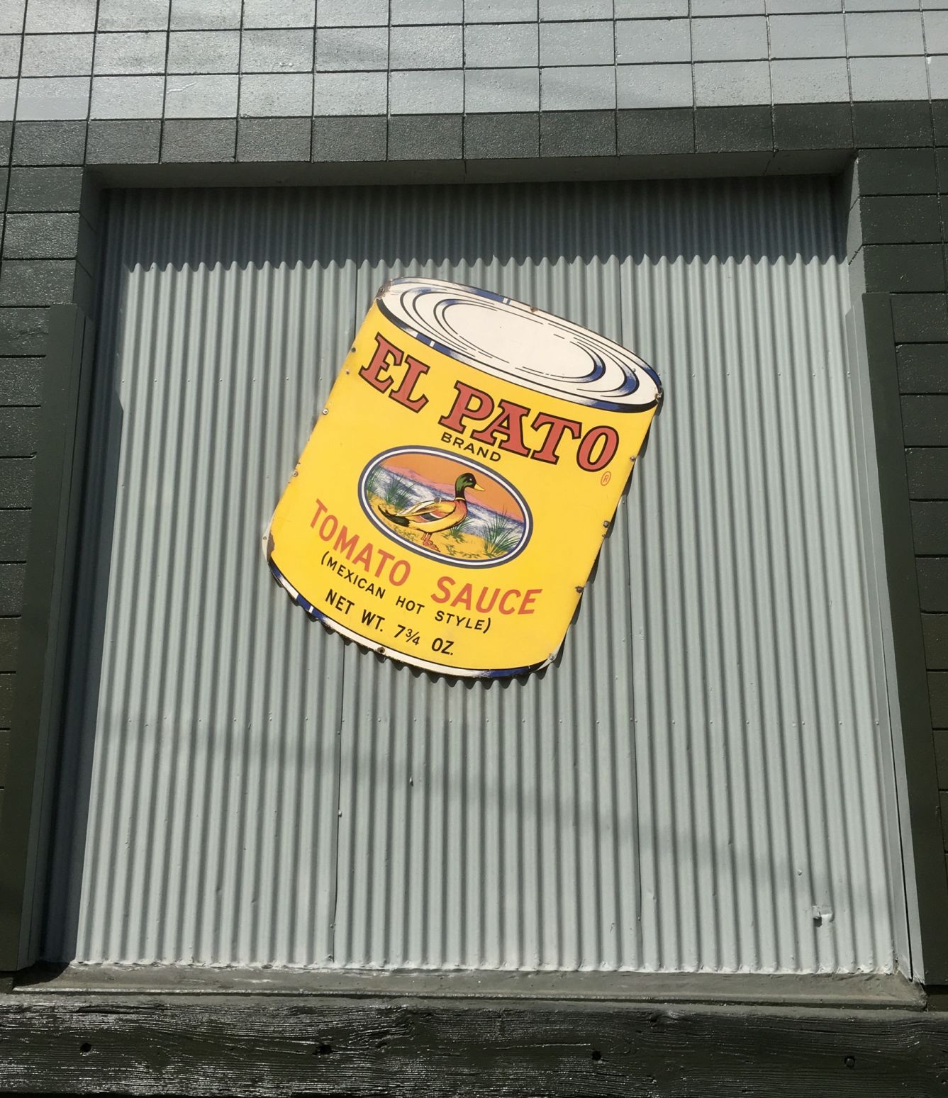 El Pato sign on loading dock in Boyle Heights